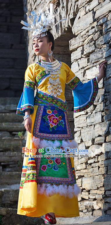 Chinese Dong Nationality Stage Performance Dress Clothing Ethnic Folk Dance Yellow Outfits and Hair Jewelry